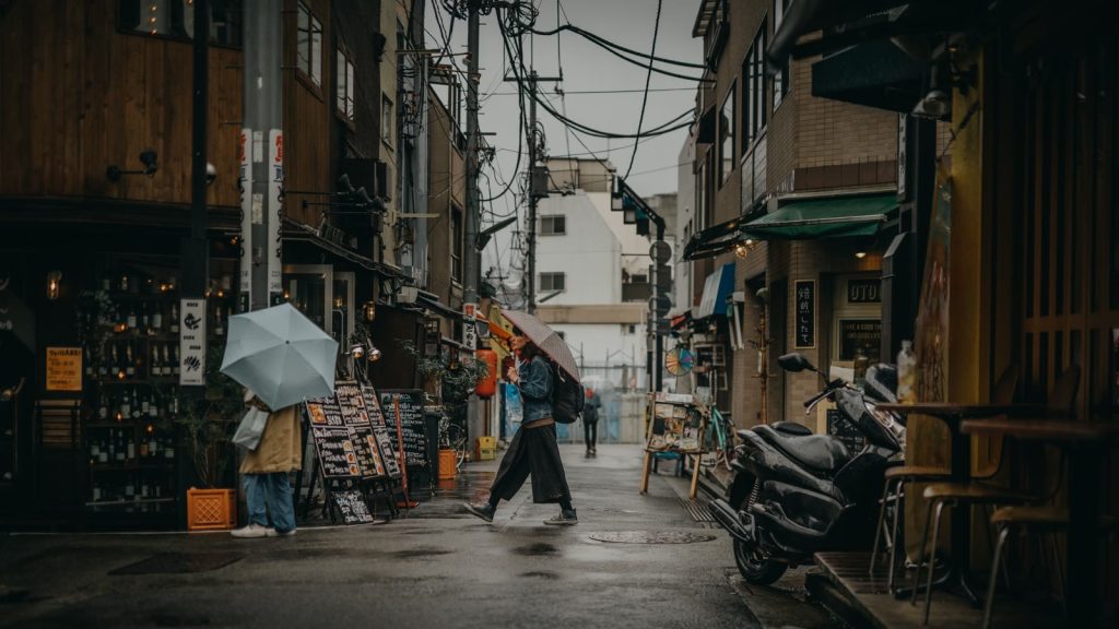 2020s rainy coastal town street (genremotiv)